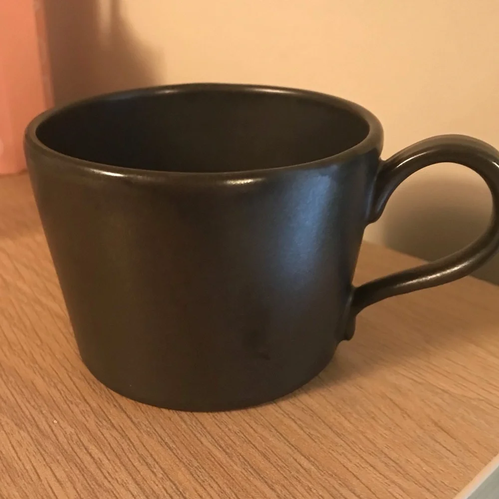 Black Anthropologie iridescent ceramic tea cup